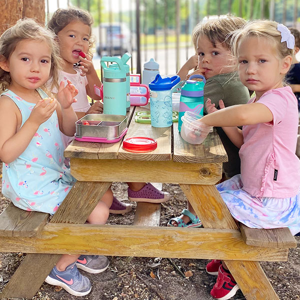 Important social time in the garden at The Children's House Montessori Preschool